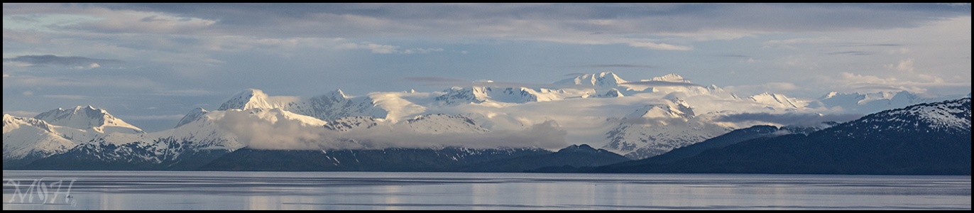 Sun on Snow Capped Mountains